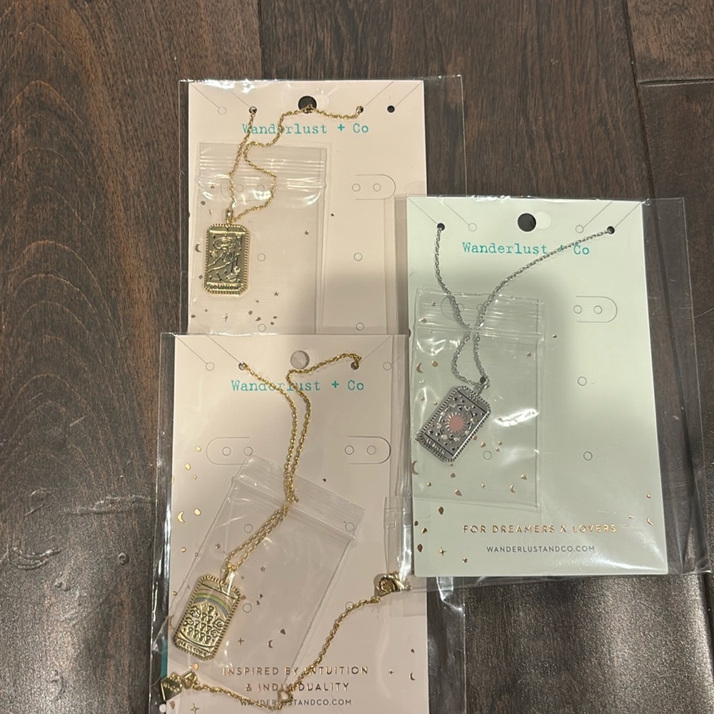 Three brand new with tags never worn wanderlust + co tarot necklaces